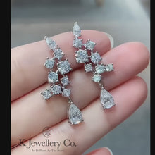 Load the video into the gallery viewer and play, Moissanite Luxury Cluster Pear Earrings Moissanite pear-shaped diamond cluster earrings
